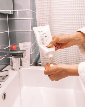 belif cream cleanser squeezed into palm of hand