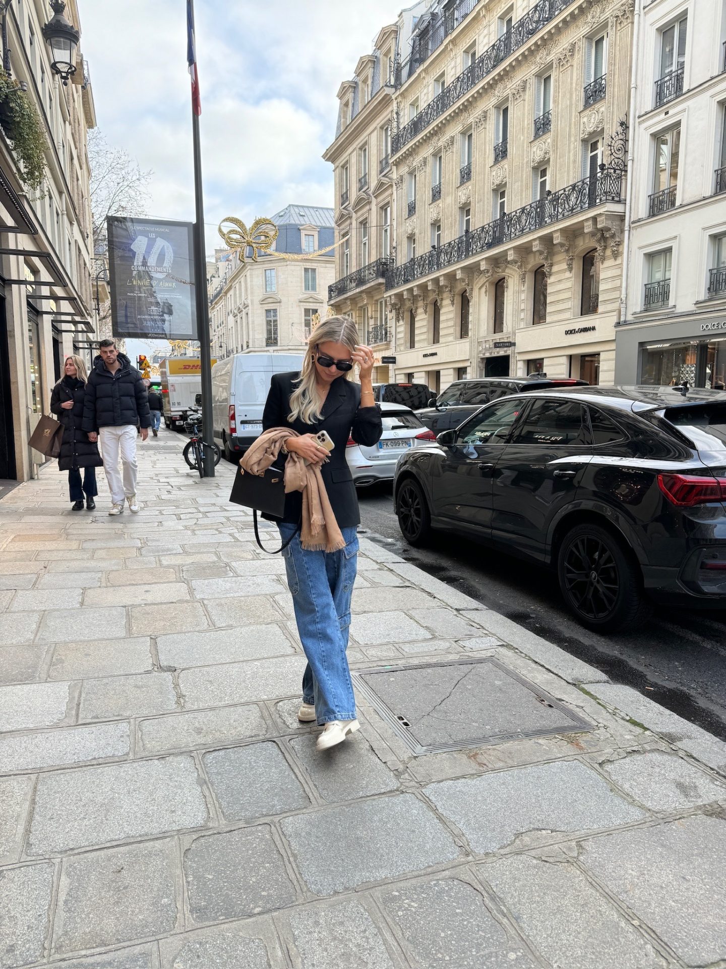 wide leg jeans with a black blazer and white loafers