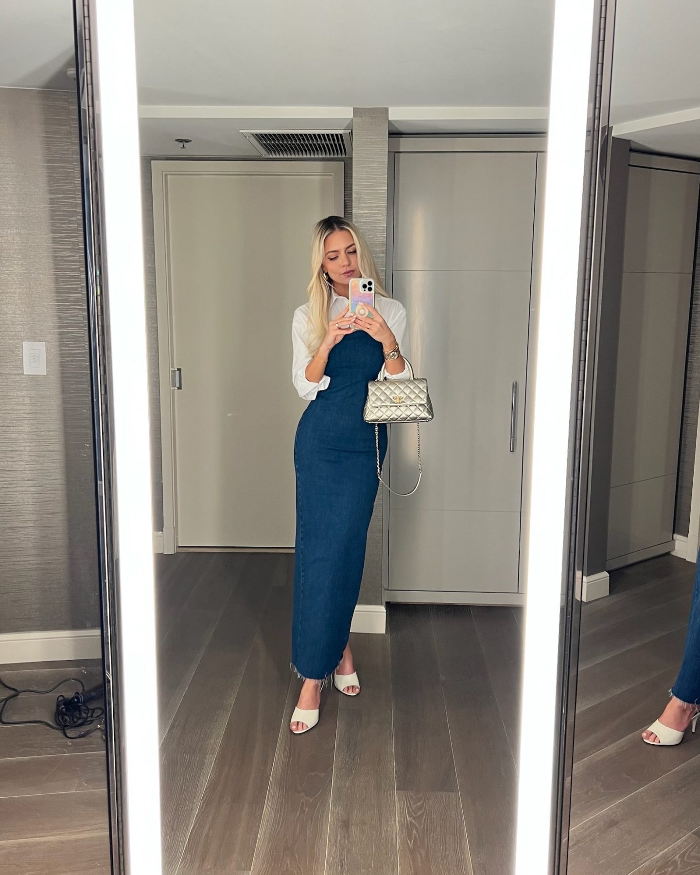 denim dress with a white button up shirt and heels