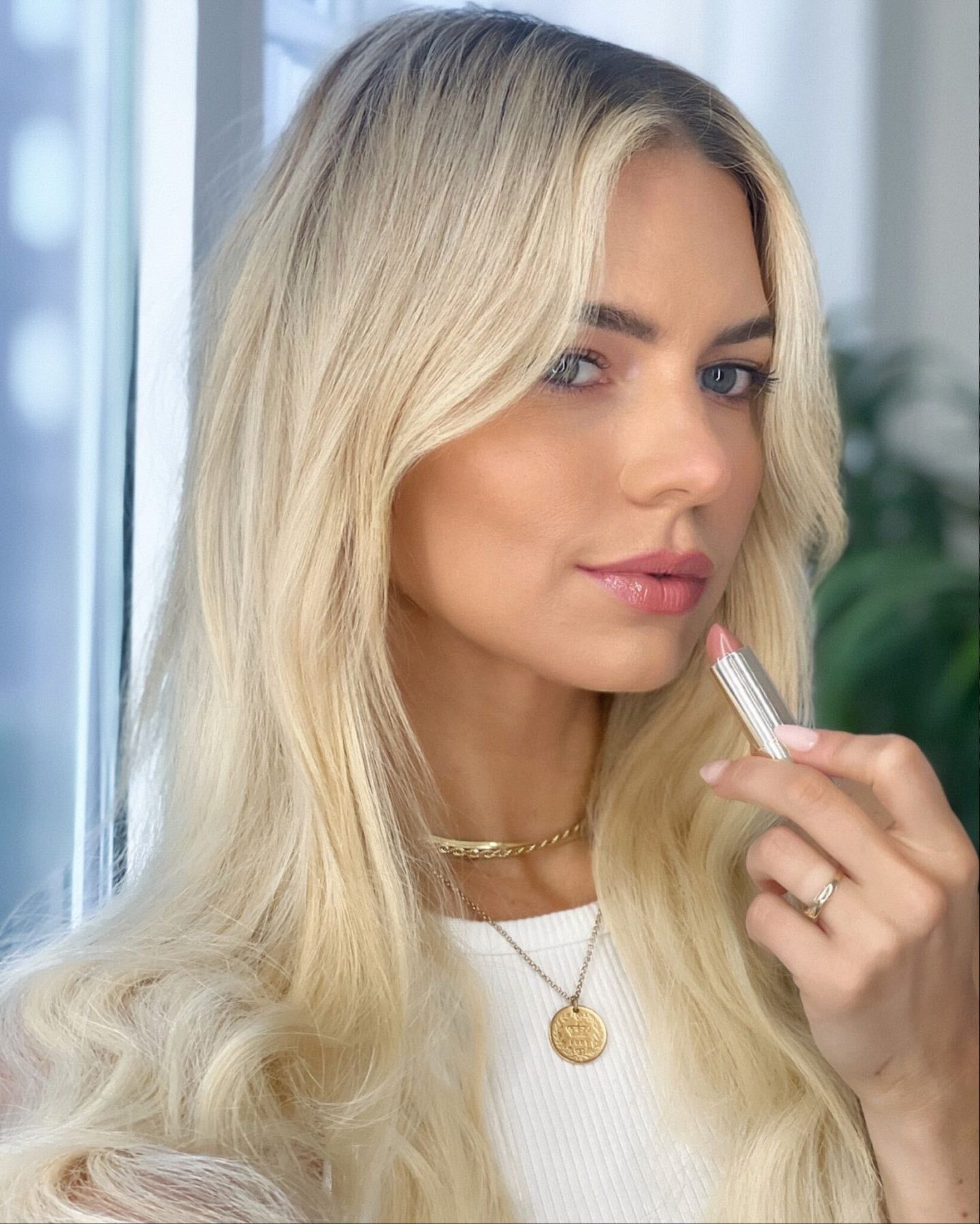 applying lipstick applying lipstick