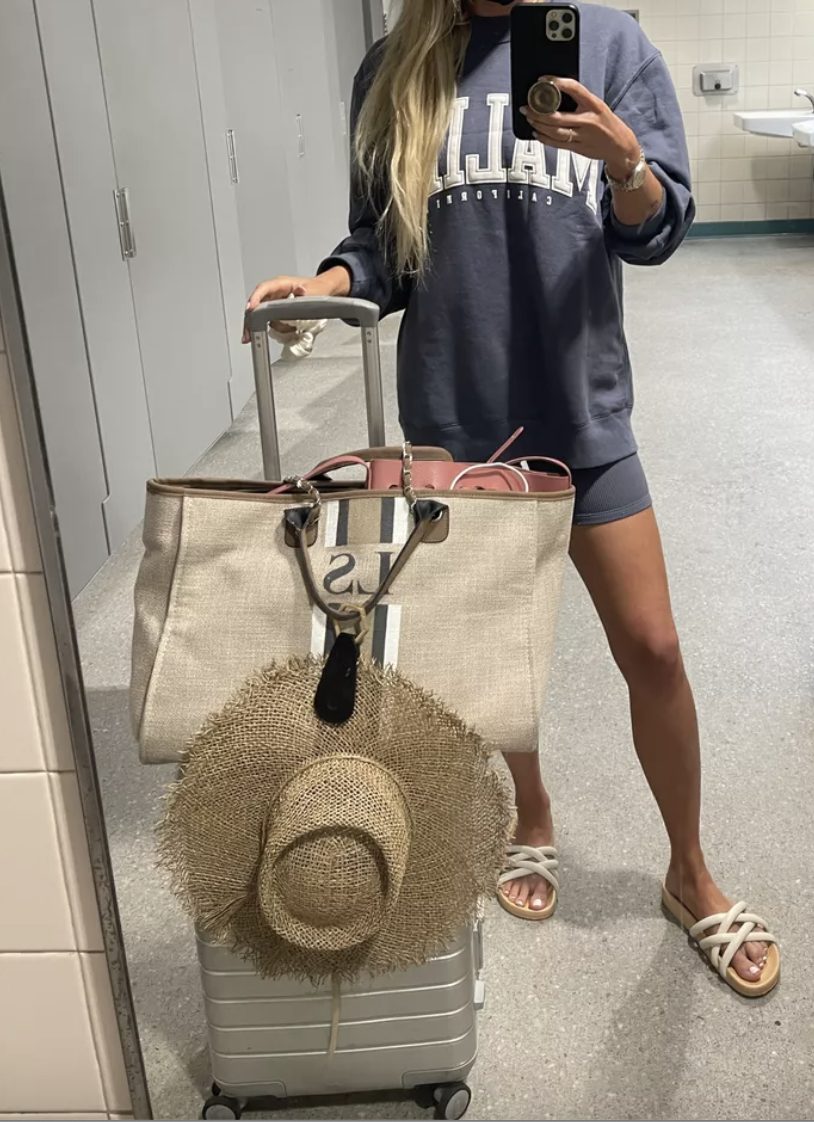 Comfy Airport Outfits for Summer bike short outfit with a sweatshirt and sandals