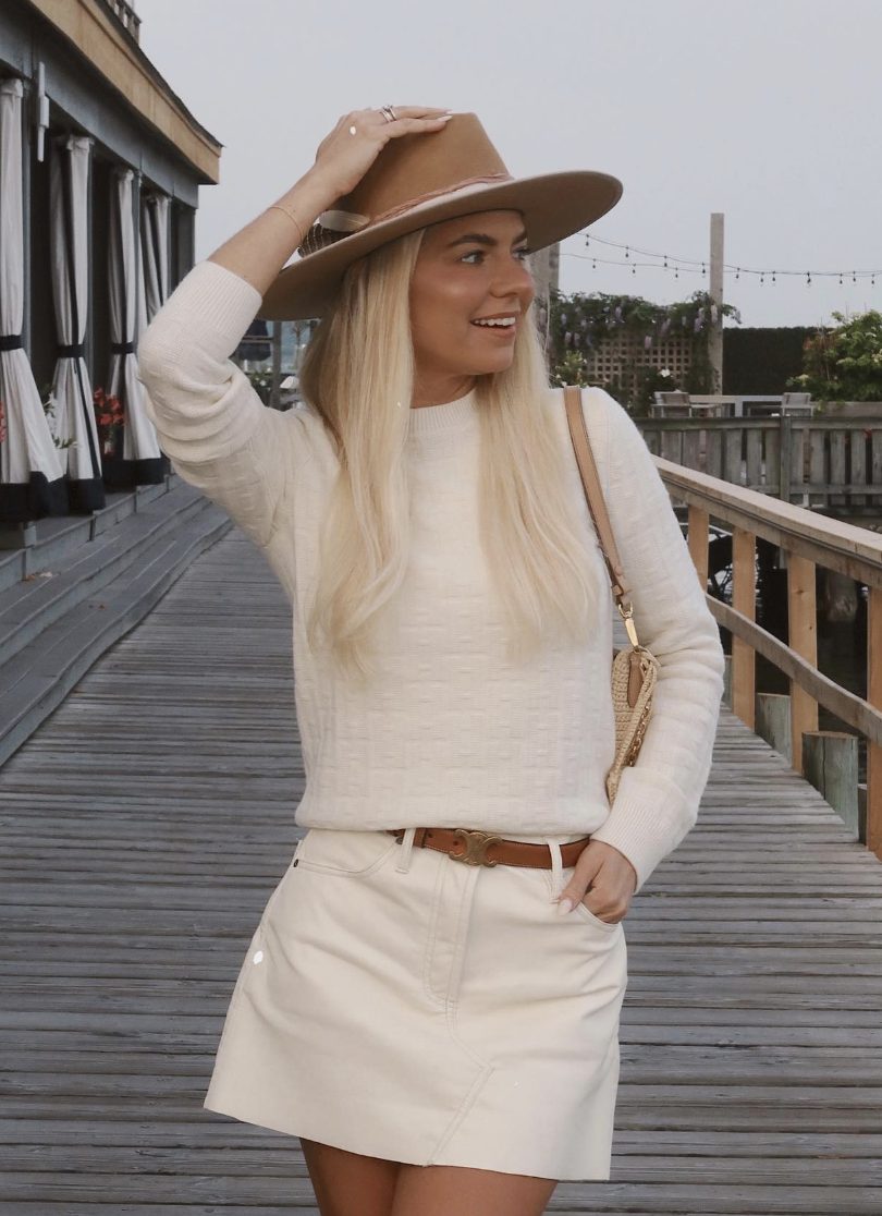 beige cropped sweater and white skirt
