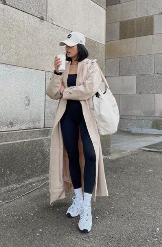 athleisure with a rain coat rainy day outfit idea - athleisure with a rain coat and baseball hat