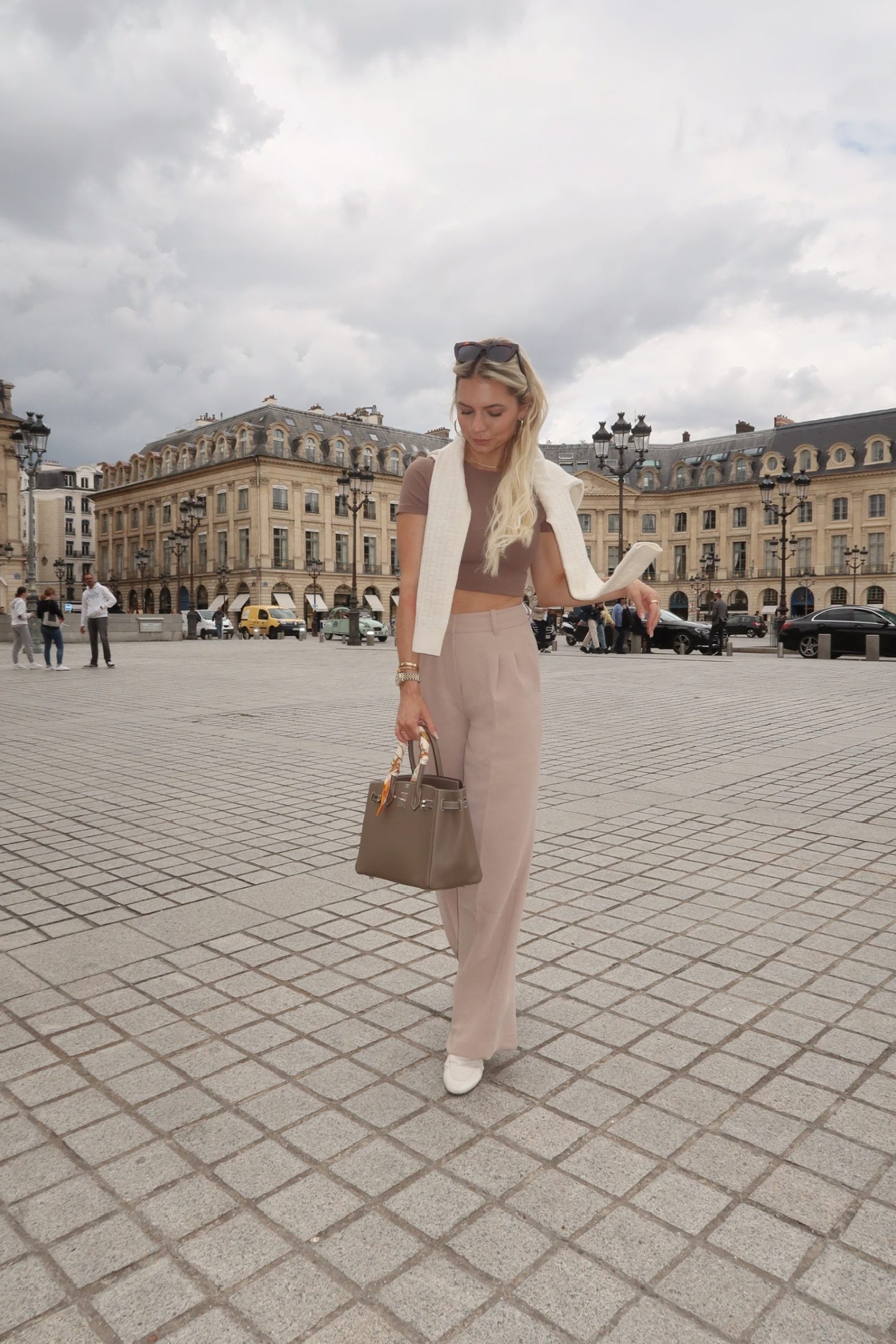 brown t-shirt with tan wide leg-trousers and heels